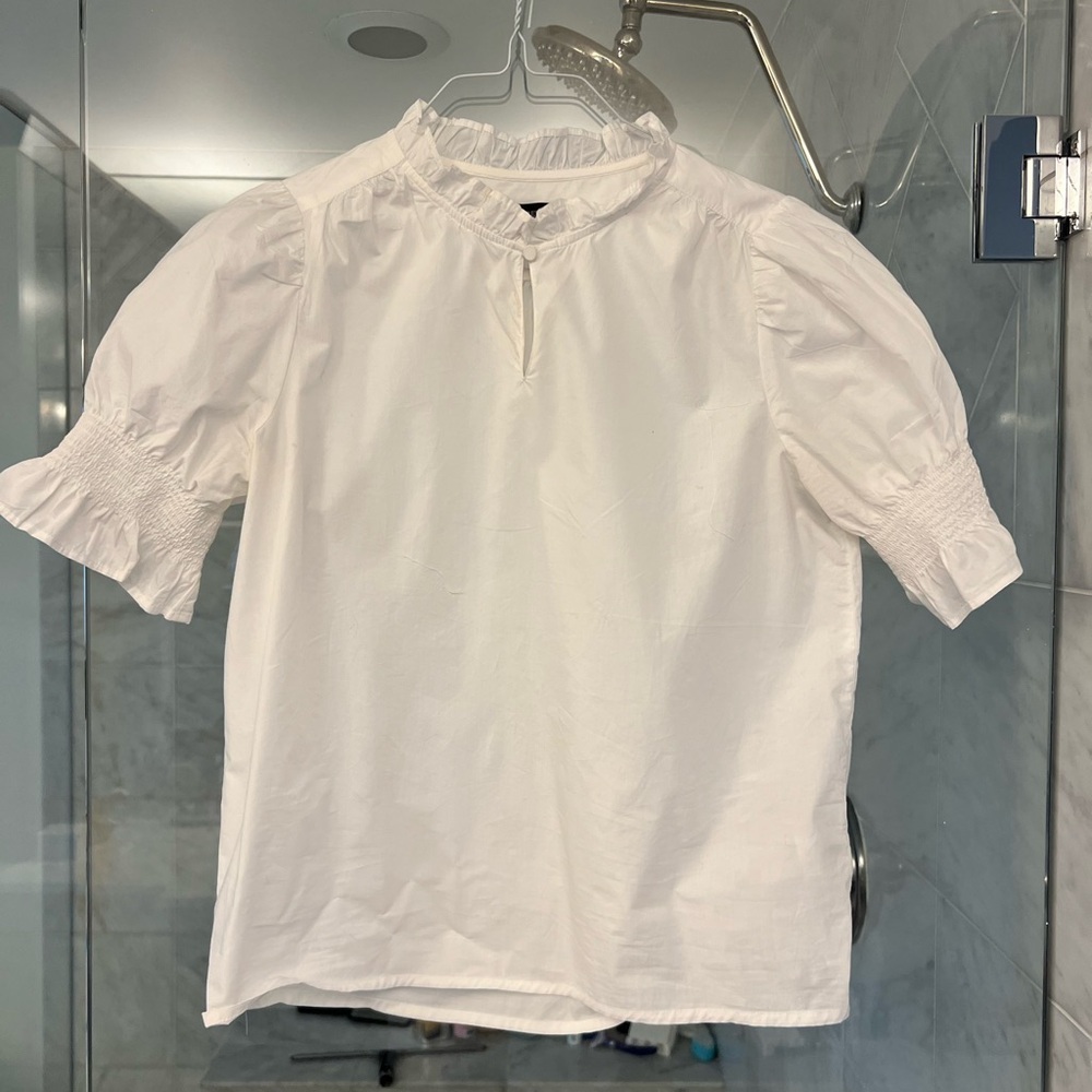 J Crew blouse with elastic on sleeves. Can be buttoned at neck or left open.